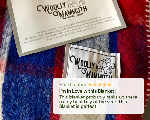 Woolly Mammoth blanket with brand card and customer review on a red, white, and blue plaid background