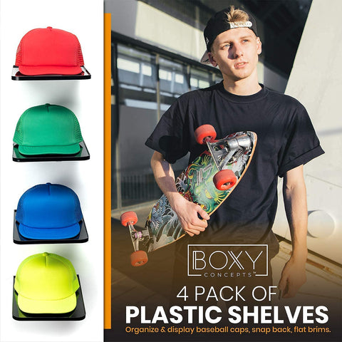 Person holding a skateboard with colorful design, surrounded by four baseball caps in different colors on a white background. BOXY Concepts branding is visible.