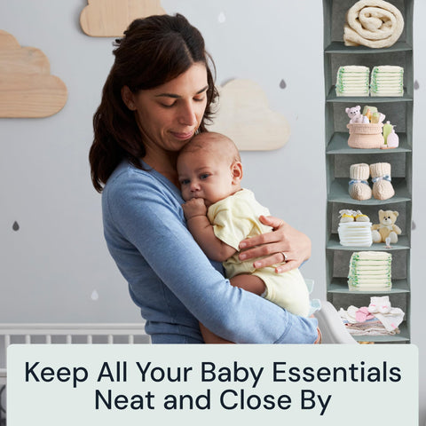 Woman holding a baby in a nursery with Boxy Concepts' foldable shelves of baby supplies.
