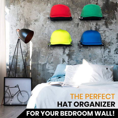 Colorful hats on Boxy Concepts' wall-mounted organizer and hat display shelves in a bedroom with a lamp and bed.