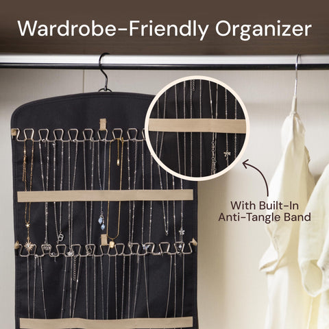 Boxy Concepts' black jewelry organizer with hanging loops and built-in anti-tangle band, showing close-up of jewelry on a white background.