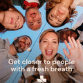 People standing in a circle with a blue sky background and text 'Get closer to people with a fresh breath'.