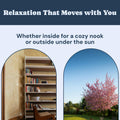 Bookshelf with books and a chair on one side, cherry blossom tree on the other, with text 'Relaxation That Moves with You' demonstrating how Todale's hanging swing for kids can be used both inside the house and outside.