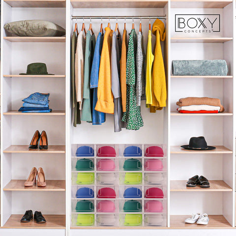 Closet with organized clothes, shoes, and hats storage boxes with 'Boxy Concepts' branding.